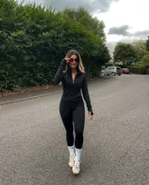 Stylish shopper wearing Fabletics leggings, ready for legging season with Gymspin detergent for gym gear freshness.