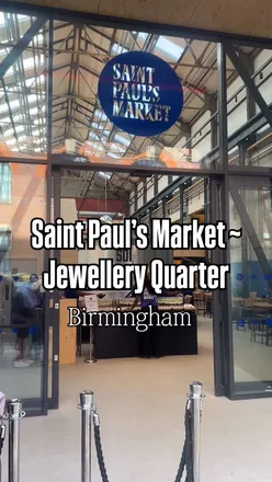 Excited diners at the new Saint Paul's Market in Birmingham's JQ, showcasing diverse food and vibrant atmosphere.