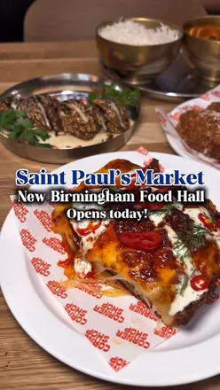 Interior of Saint Paul's Market, a new vibrant food hall in Birmingham's Jewellery Quarter featuring diverse local eats.