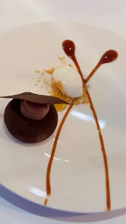 Decadent Valrhona Caramelia and Miso Gateau with silky crémeux and Greek yoghurt sorbet at Branches Restaurant.
