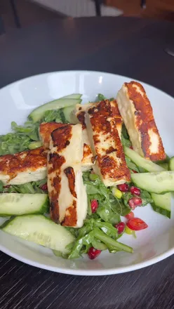 Two delicious plates at Arts Bar, Hope Street, Liverpool, showcasing vibrant art and appetizing food for £10.