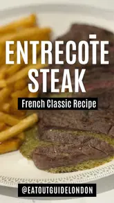 Classic French Entrecôte steak served with golden fries and buttery herb sauce, embodying bistro culture.
