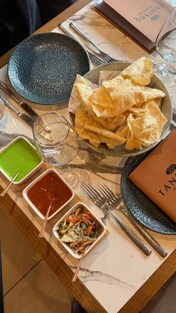 Dining at Tanishq in Toothill, Ongar - savoring gourmet Indian dishes with stunning golf course views.