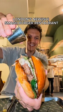 Smash burgers and loaded nacho cheese fries at Heard Burger's opening in Soho, London, by chef Jordan Bailey.