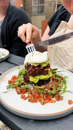 Brunch spread featuring pancakes, coffee, and pastries at a cozy café in Sheffield, perfect for lazy Sunday gatherings.