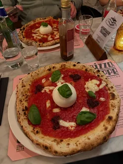 Delicious burrata picante pizza and unique toppings at Pizza Beppé during a spontaneous food trip.