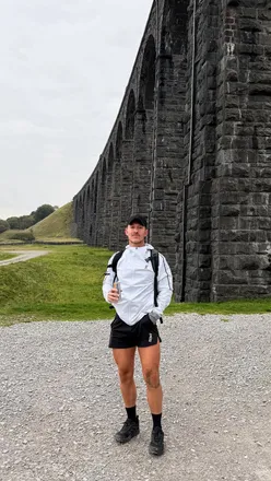 Runner celebrating completing 24 miles in under 8 hours, motivated for the next fitness challenge with Tog24 gear.