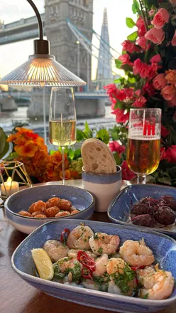 Delicious dinner at Vu from The Tower, London, featuring lamb kofta, squid balls, tiger prawns, and sirloin steak.