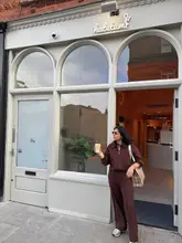 Chic loungewear and coffee ambiance, showcasing stylish outfits and good vibes at a cozy Leeds café.