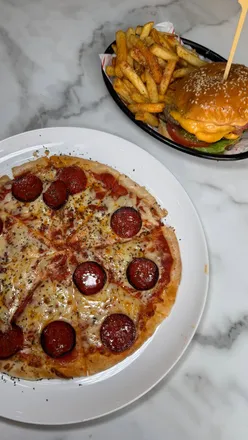 Guests enjoying diverse cuisines at Victoria Street Collective in Metquarter, Liverpool, featuring Italian to American options.