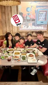 Patrons enjoying Vietnamese dishes at Pho Restaurant's new location in St Albans, Hertfordshire.
