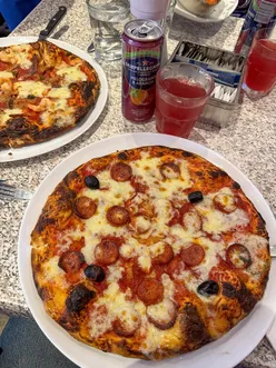 Birthday weekend celebration with pizza, ice cream, and coffee by the beach at sunset.