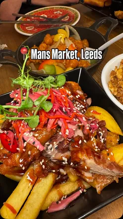 Delicious dim sum and sweet and sour chicken at Mans Market, Leeds, featuring chopstick fries and egg fried rice.