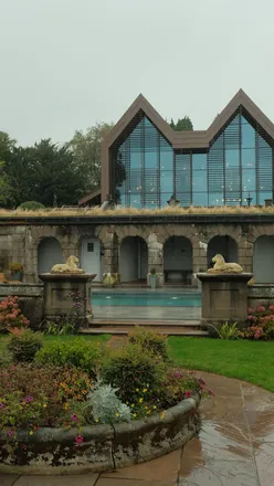 Scenic woodlands at The Tawny Hotel, featuring vibrant autumn leaves, outdoor pool, and hot tubs for a perfect getaway.