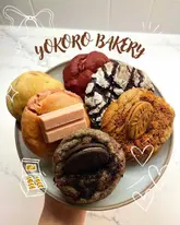 Delicious cookies from Yokoro Bakery in Birmingham, showcasing a mixed box of various flavors and beautiful packaging.