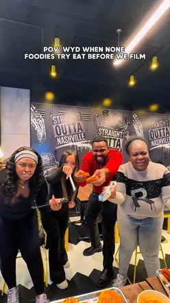 Foodies enjoying smoky dishes at a vibrant London restaurant, capturing a fun and humorous dining experience.