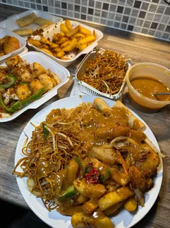 Delicious takeaway spread from Rice Delight in Alexandria, featuring salt and pepper chicken, egg fried rice, and satay sauce.
