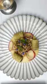Elegant black pudding dish showcased at Myrtle Restaurant, highlighting its nutritious benefits in fine dining.