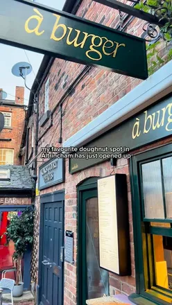 Delicious burgers and tasty doughnuts at à Bloc in Kings Court, featuring vibrant outdoor dining and live music.