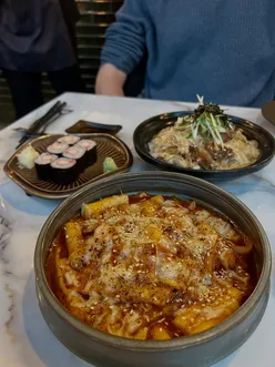 Delicious Korean and Japanese dishes at Oba in Leeds, featuring gyoza, chicken wings, maki rolls, and more.