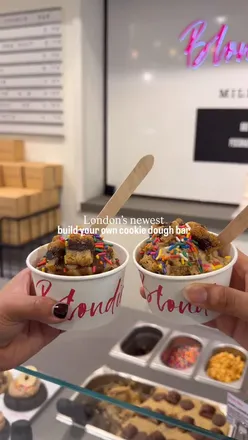 Cookie dough lovers customizing treats at London’s new Blondie’s Kitchen dessert bar in Selfridges foodhall.
