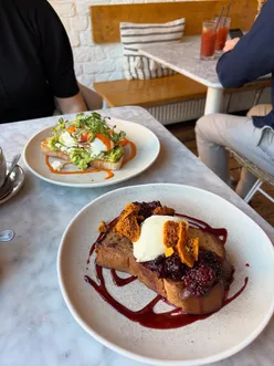 Delicious Raspberry & Honeycomb French Toast and Smashed Avocado at Minna, Lark Lane, perfect for Sunday brunch.