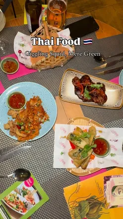 Delicious Thai cuisine at Giggling Squid, Mere Green, featuring vibrant dishes and beautiful decor.