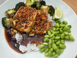 Glazed tofu with soy garlic dressing, sticky rice, charred broccoli, and edamame topped with crispy chili shallots.