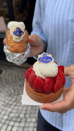 Exploring delicious pastries on a Paris Bakery Tour, sampling croissants and BBQ treats.