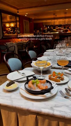 Cozily dining at Henrietta in Covent Garden, enjoying duck fat fries, caviar, and sticky toffee madeleines.