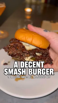 Friends enjoying food at Chucks NYC, Carousel in London, capturing a fun dining experience.