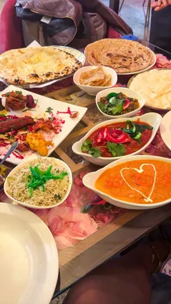 Interior of Spice Bloom on Duke Street, Liverpool, adorned with flowers, showcasing vibrant decor and delicious Indian cuisine.