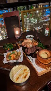 Indulge in a Sunday roast at Miller & Carter Cardiff with prime cuts, luxurious sides, and unlimited gravy.