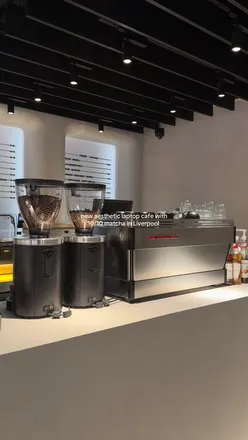 Customers enjoying healthy food and working on laptops at hiigrind co-working cafe in Liverpool, located in Flannels.