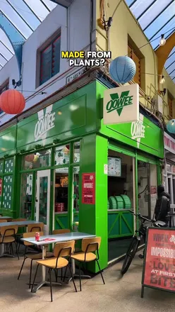 Enjoying the Love at First Bite vegan menu at Oowee Vegan in Brixton, featuring bold plant-based burgers.