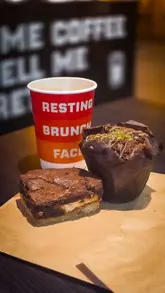 Bagels, brews, and sweet treats at Resting Brew Face, a cozy café in Aberdeen offering vegan options and specials.