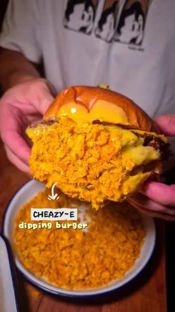 Cheazy-e burger with hash brown, nacho cheese sauce, and Doritos at Smokey Trotters Kitchen in Glasgow.