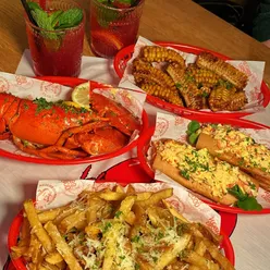 Enjoying Canadian lobster and decadent dishes at Neighbourhood Cardiff, perfect for seafood lovers!