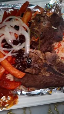 Exploring Somali cuisine at Bello’s Kitchen in Manchester during Moss Side Food Tour Episode 3.