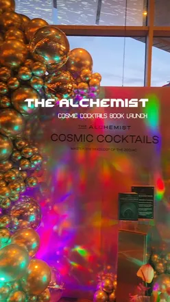 Launch party at The Alchemist for Cosmic Cocktails recipe book featuring astrology-inspired drinks and entertainment.