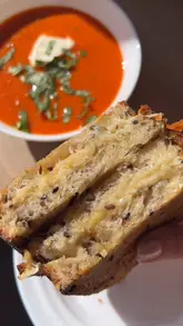 'Delicious Tomato & Basil Soup with chicken broth and creme fraiche, perfect for a cozy autumn lunch.'