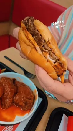 Delicious comfort food at Slamburger Leicester, featuring burgers, popcorn chicken, and desserts in a welcoming atmosphere.