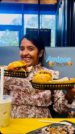 Delicious burgers, milkshakes, churros, and fries at Amigos Burgers in London, featuring buttermilk chicken and loaded desserts.