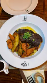 Delicious meal at The Boot Inn in Soulbury, featuring lamb bonbons, Scotch egg, and sticky toffee pudding.
