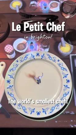 Guests enjoying an immersive dining experience with Le Petit Chef at DoubleTree by Hilton, Brighton Metropole Hotel.