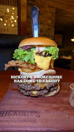 Enjoying Southern-inspired dishes at Hickory's Smokehouse opening in Cardiff, featuring bold flavors and a cozy atmosphere.