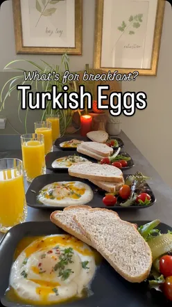 Delicious Turkish Eggs topped with chili butter and served with garlic yogurt on a stylish plate from @ikeauk.