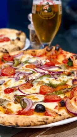 Delicious pizza and vegetarian parmigiana at Pizzeria 1926 in Dalry, Edinburgh.