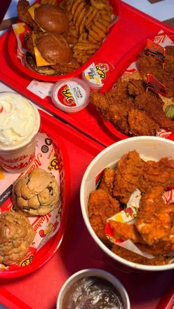 Delicious halal chicken tenders, sliders, and cookies at Lucky B's in Glasgow, celebrating local food culture.
