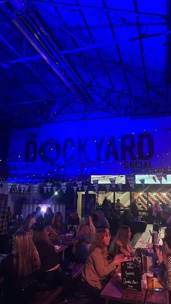 Visitors enjoying food and drinks at Dockyard Social in Glasgow, a vibrant hub for winter entertainment.